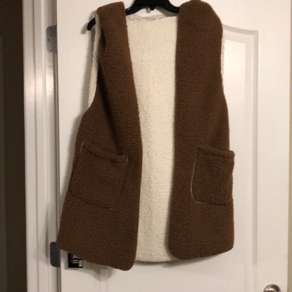 Reversible vest with hood